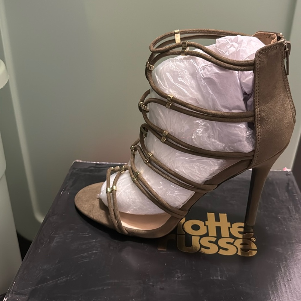 Olive colored open heel with gold claps on the straps